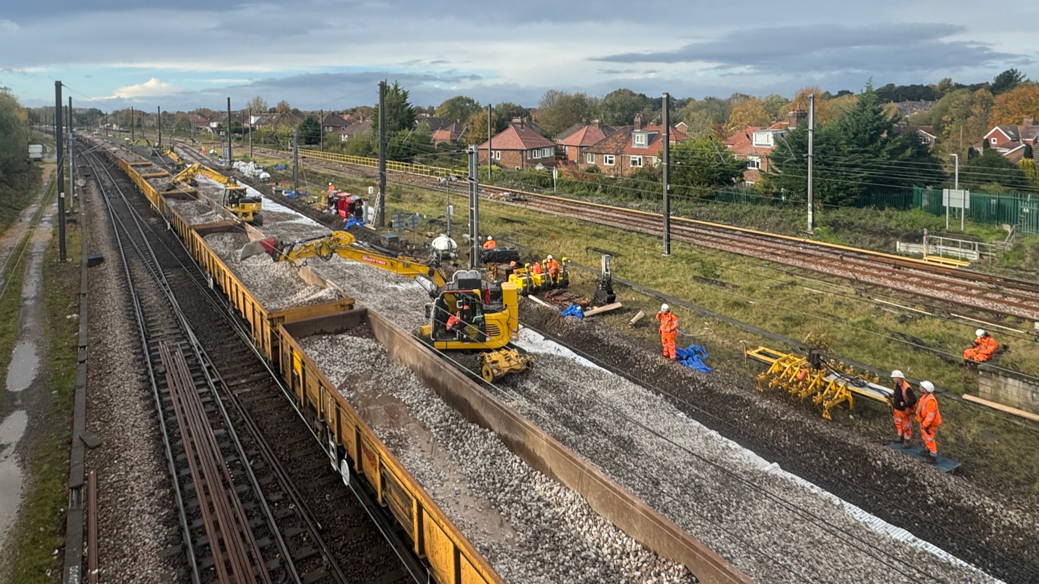 Engineers renewing track and ballast on a railway line during a weekend possession